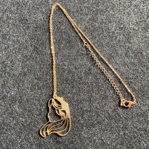 Abstract golden portrait necklace